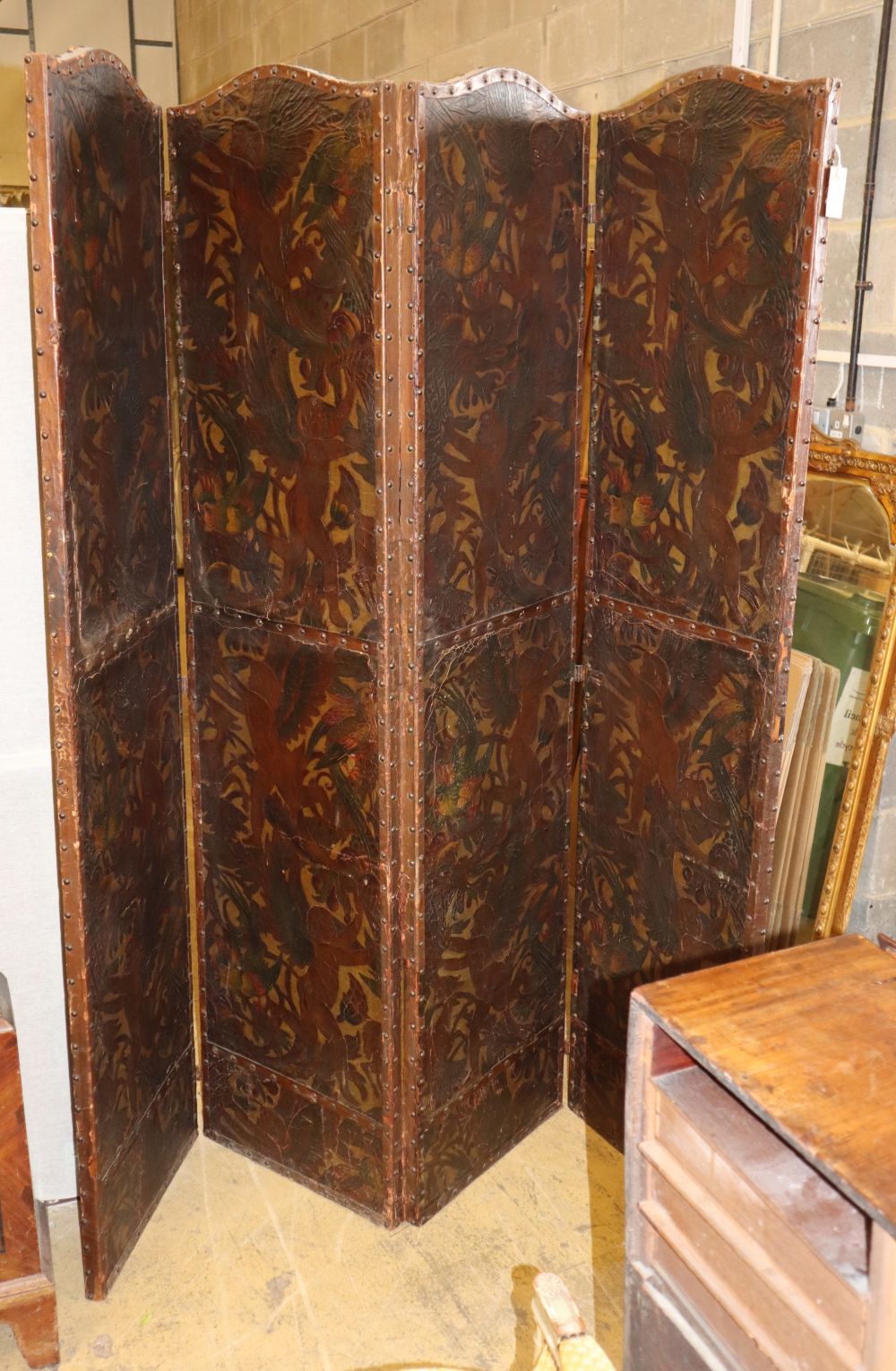 A Dutch leather four fold screen, c.1860, each panel 49cm x 203cm